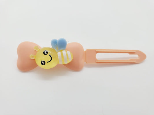 Yellow Bumblebee on a peach Top Knot Clip for dogs
