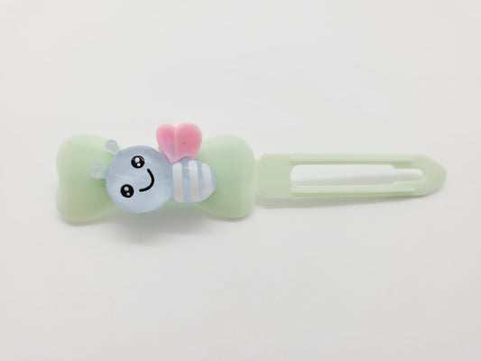 Blue Bumblebee on a mint green Top Knot Clip for dogs