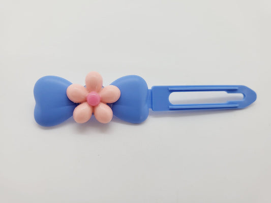 Pretty Pink Flower on a sky blue Top Knot Clip for dogs