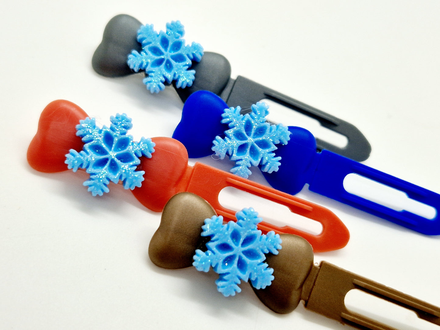 Blue glitter snowflake top knot clips