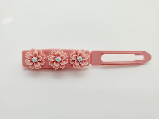 Pretty pink Daisy Chain Flower Top Knot Clip